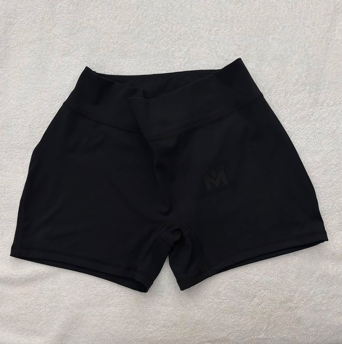 Black Pressure Short product detail with smooth matte performance fabric